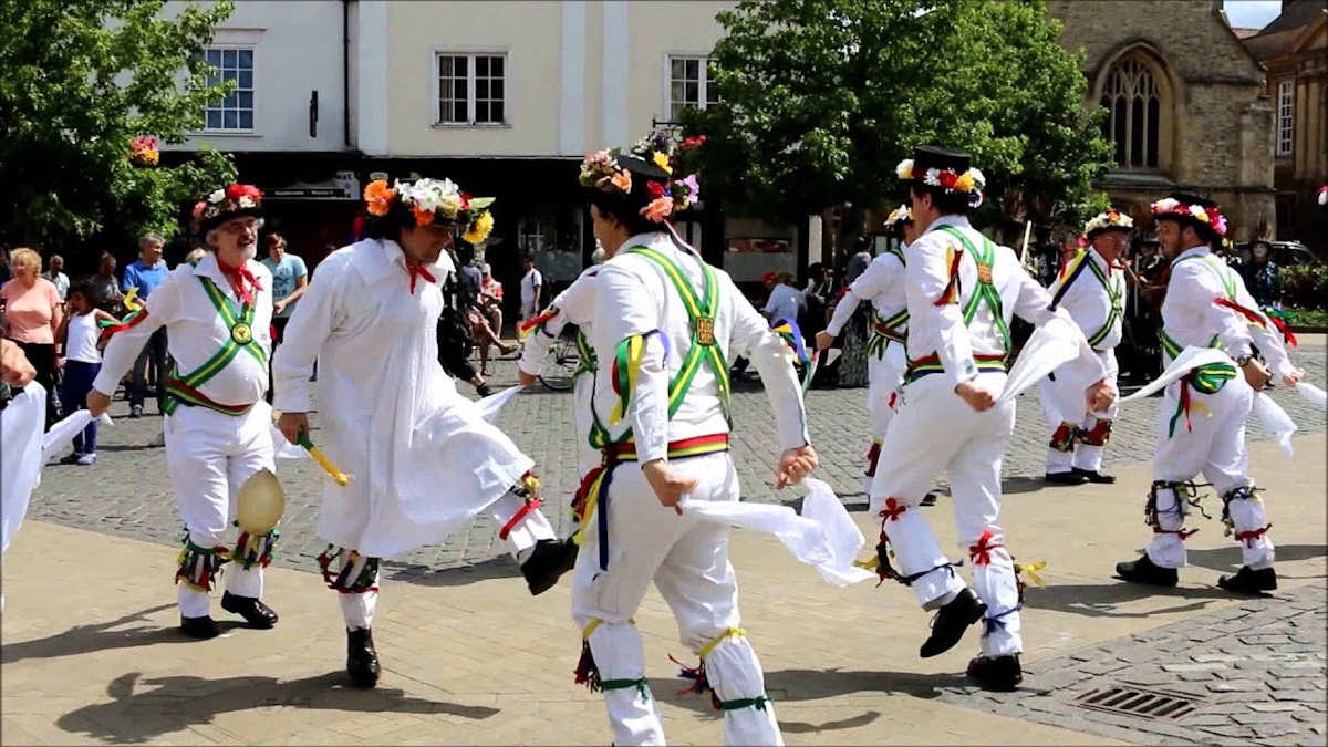 Morris dancers performing in traditional costumes