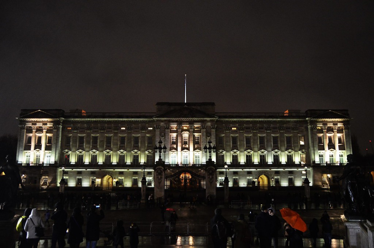 Buckingham Palace at night with illuminated facade