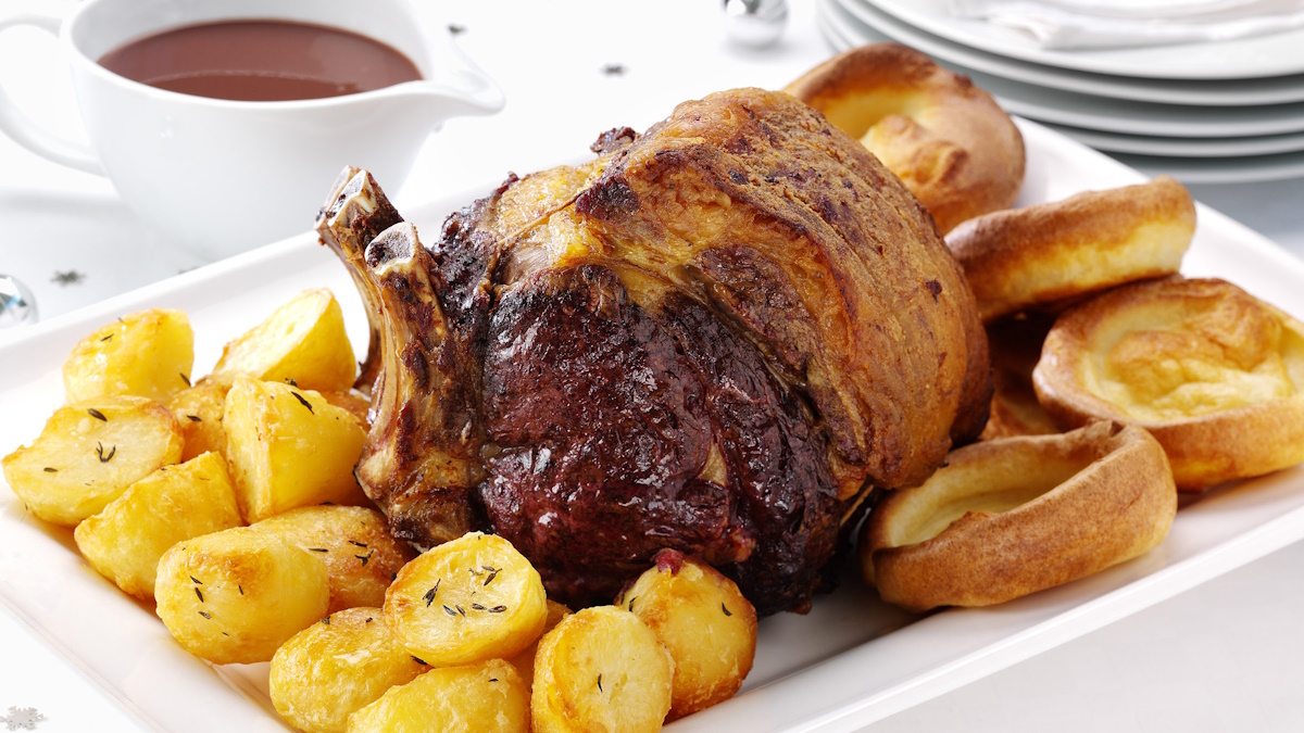 Sunday roast with roast beef, Yorkshire pudding, and vegetables